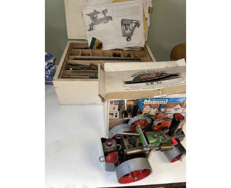 Mamod Steam Roller in box and a box of Meccano with instructions.