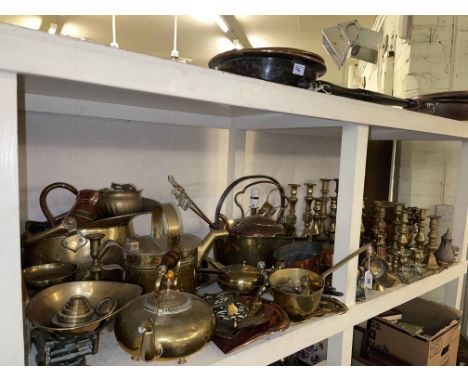 Collection of brass and copper wares including candle holders, scales with weights, jam pan, kettles, bed pan, coal scuttle, 