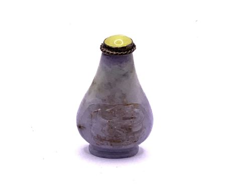 A small carved lavender jade snuff bottle with dragon decoration. 4.5cm