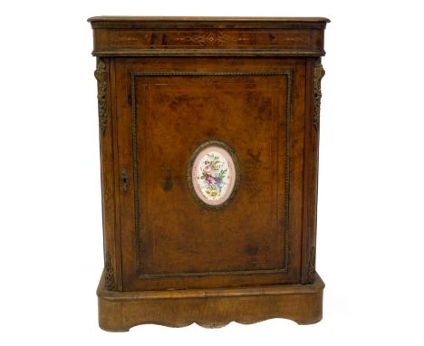 A Victorian burr and figured walnut pier cabinet, with moulded  top over a strap work marquetry frieze with gilt metal mounts