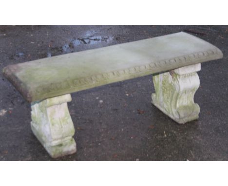 A 20thC carved stone garden bench, the rectangular top raised on double scroll feet, 43cm H, 114cm W, 40cm D. With the option