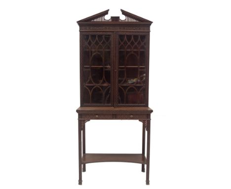 A late Victorian Chinese Chippendale revival display cabinet on stand, with dentil moulded and fretwork broken arch pediment,