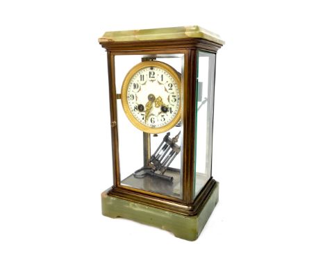 EARLY 20TH CENTURY ONYX FOUR GLASS MANTEL CLOCK, with cream enamel dial and mercurial pendulum, 27cm high