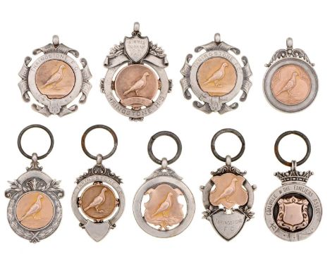 Eight George V Northern England silver racing pigeon prize watch fob shields and one other, various sizes, makers and dates, 