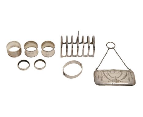 An Elizabeth II silver seven hoop toast rack, 11.5cm l, by William Suckling Ltd, Birmingham 1960, a silver purse engraved wit