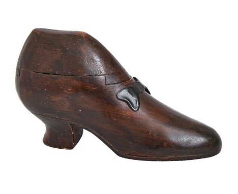 Treen. A carved and stained wood shoe novelty table snuff box, with painted metal bow, 20.5cm l Minor knocks and scratches, o