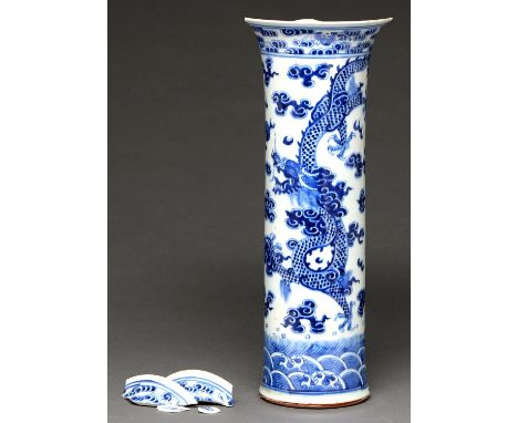 A Chinese blue and white sleeve vase, Qing dynasty, Kangxi period, painted with dragons and bats, 43cm h Damaged with loss