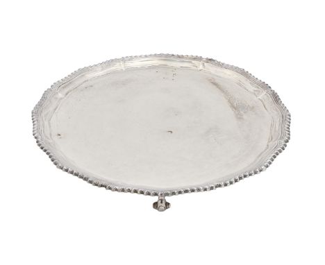 An Elizabeth II silver salver,&nbsp; with gadrooned rim, on four volute feet, 31cm diam, Roberts &amp; Belk Ltd, Sheffield 19