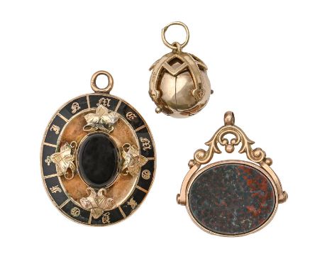 A Victorian agate and gold and enamel mourning brooch, the back inset with plaited hair, adapted as a pendant, 37mm, a 9ct go