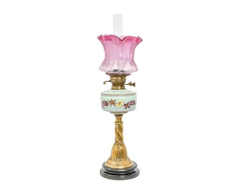 A brass oil lamp, the opaline shade decorated with flowers and etched cranberry glass shade, early 20th c, 71cm h Good condit