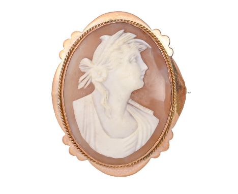 A cameo brooch, the oval shell carved with the head of a woman, gold mount, 47mm, marked 9ct, 8.5g Very fine hairline crack r