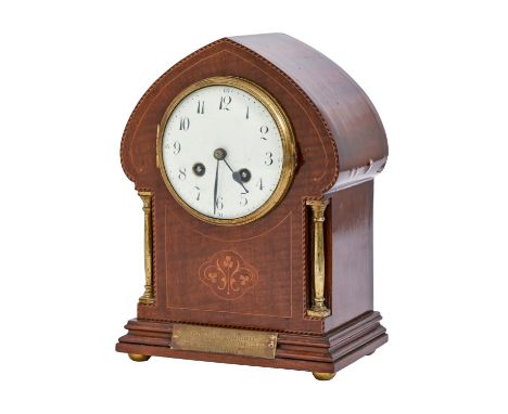 An Art Nouveau style brass mounted and inlaid mahogany mantel clock, c1920s, with enamel dial, pendulum, 26cm h Veneer liftin