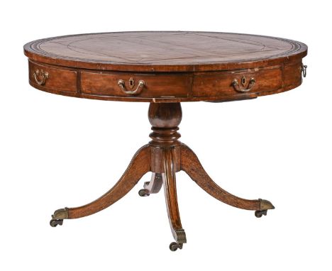 A Victorian mahogany drum table, with tooled leather top, turned pedestal base on brass castors, 74cm h; 114cm diam Leather t