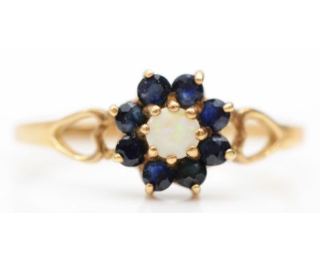 A 9ct gold opal and sapphire floral cluster ring, N, 1.1gm.Condition report - The middle opal is chipped with cracks, thinnin