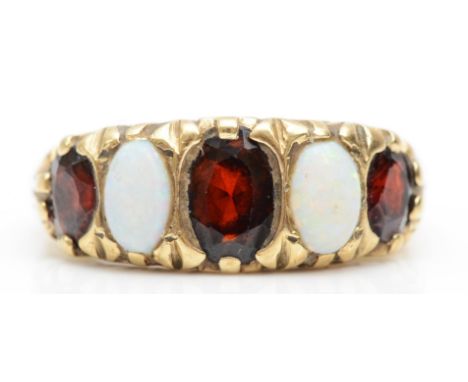 A 9ct gold five stone garnet and opal dress ring, with scroll decorated setting, N, 4.1gm. 