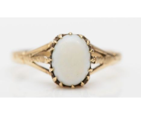 A 9ct gold opal dress ring, K, 1.6gm.Condition report - the top of the dome on the cabochon is marked and scratched distortin