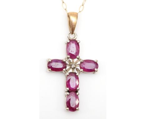 A 9ct gold ruby cross pendant on chain, 25 x 16mm, 2.9gm. 