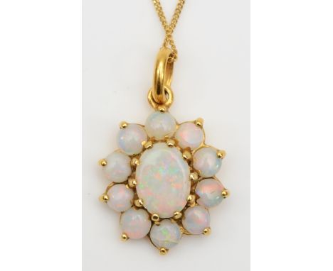 A 9ct gold opal floral pendant, on chain, flashes of red and green, 15 x 11mm, 1.5gm.Condition report - Bottom opal is cracke