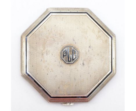 An Art Deco silver compact, London 1933, with applied black enamel PLG monogram, mirror, no powder fittings, 7.5cm, 90gm