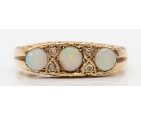 A 9ct gold three stone opal dress ring, flashes of red, orange, green and blue, Q, 3.9gm.Condition report - The middle opal i