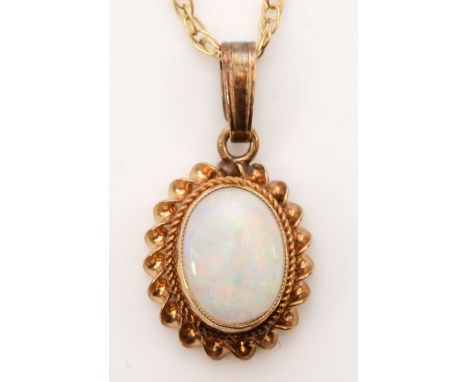 A 9ct gold opal pendant, on chain, flashes of red, green and blue, 12 x 9mm, 1.3gm.Condition report - The opal has light scra