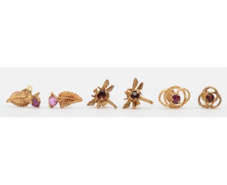 Three pairs of unmarked rose gold ruby and garnet stud earrings, 1.5gm. 