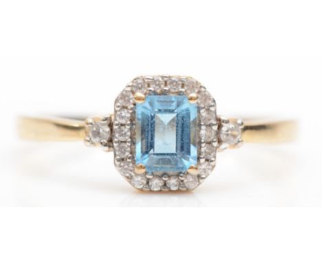A 9ct gold aquamarine and cubic zirconia cluster ring, 