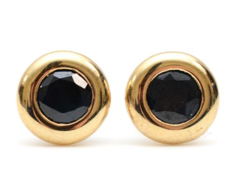 A pair of 9K gold collet set sapphire stud earrings, 7mm, 1.1gm. 