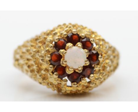 An unmarked gold opal and garnet dress ring, K, 5.3gm. 