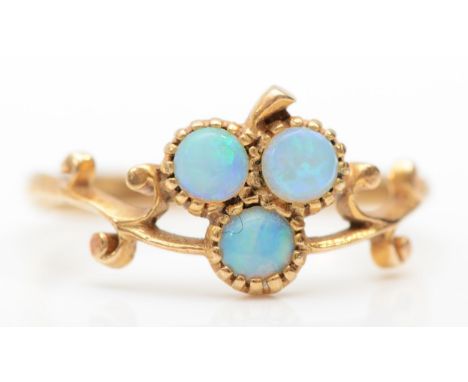 A 9ct gold opal clover dress ring, with scroll decorated setting, N, 1.7gm.Condition report - Overall good condition with a l