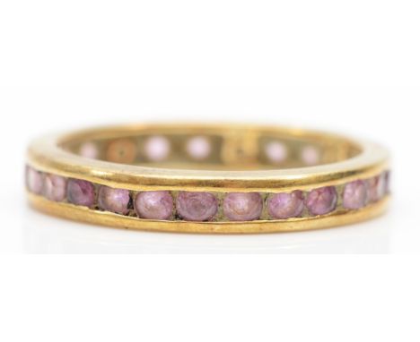 A 9k gold pink sapphire full eternity ring, S, 2.6gm. 