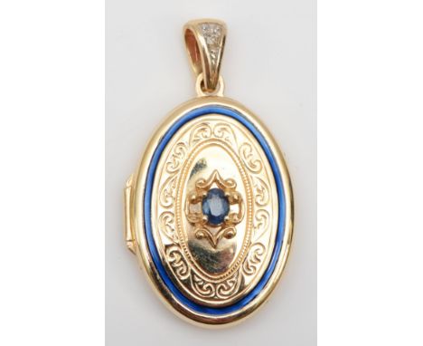 A 14ct gold sapphire and enamel oval locket, 35 x 19mm, 4.4gm. 