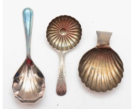 A George III silver bright cut caddy spoon, Birmingham 1796, another shell bowl caddy spoon, lion passant and partial maker a
