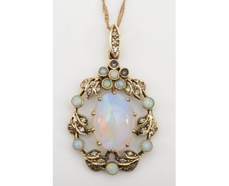 A 9ct gold opal and diamond floral pendant, on chain, flashes of red, blue and green, 35 x 21mm, 4.7gm.Condtion report - midd