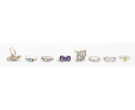 A group of eight silver rings to include a opal set example, P-Q, 