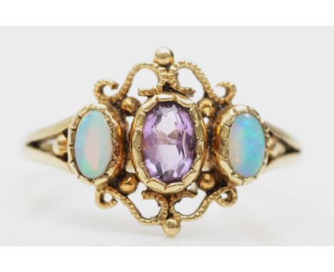 A 9ct gold opal and amethyst three stone dress ring, P, 2gm.Condition report - Overall good condition with light marks and sc