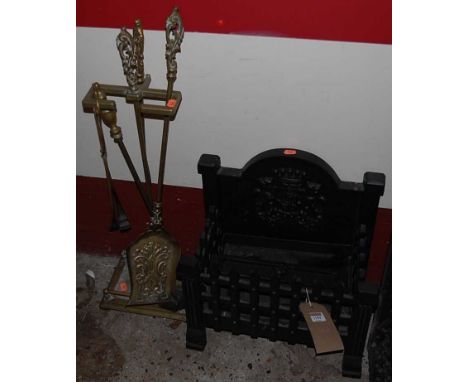 A contemporary black painted cast iron small fire basket, width 40cm, together with an early 20th century set of brass fire t