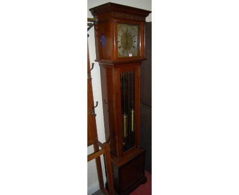 An Edwardian mahogany grandmother clock, the silvered dial within pierced spandrels, having triple weight driven movement, wi