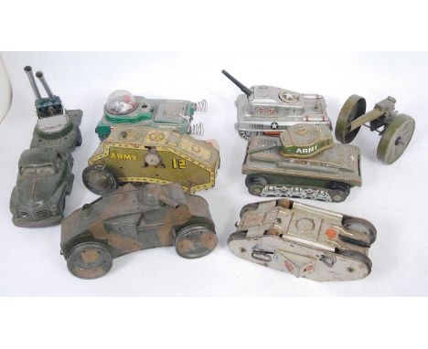 A collection of loose tinplate, clockwork and battery operated military and space tinplate toys and accessories, mixed exampl