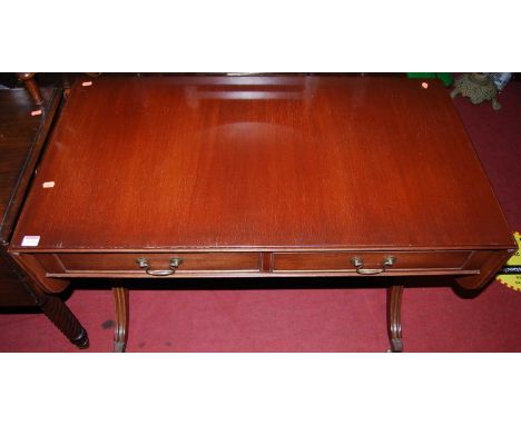 A reproduction mahogany dropflap sofa table, having twin frieze drawers, w.104cm (leaves down)