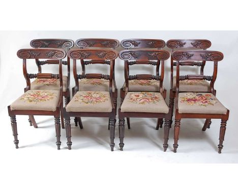 A set of eight William IV Scottish rosewood barback dining chairs, each having reeded and flower head carved centre rails, dr