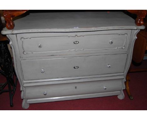 A 19th century provincial French and later grey painted pine serpentine front three drawer commode chest, width 107cm