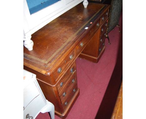 A mid-Victorian mahogany round cornered and Greek key gilt embossed tan leather inset twin pedestal writing desk, having an a