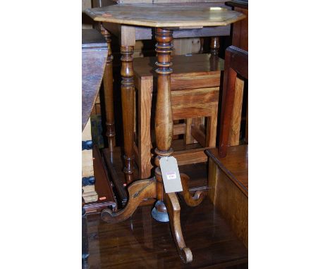 A Victorian faded mahogany octagonal topped fixed pedestal tripod occasional table, having a weighted base, dia. 45cm