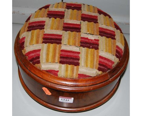 A Victorian figured walnut and upholstered inset circular hinge-top low footstool, with inset ceramic dish, dia.27.5cm 