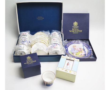 A Royal Worcester set of six coffee cans and saucers with botanical decoration, a commemorative plate and ramekin both boxed 