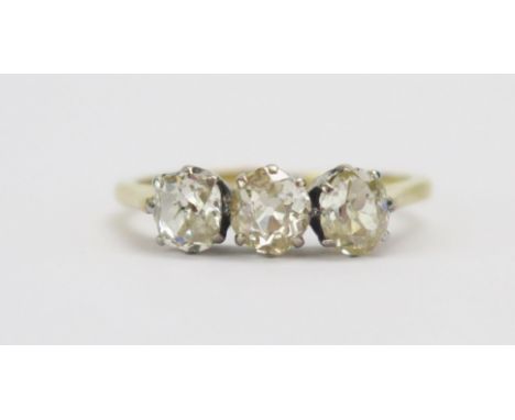 An 18ct Gold and Old Cut Diamond Three Stone Ring, central stone c. 4.8mm, size M.5, stamped 18CT, 2.66g