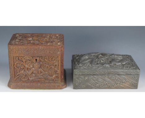 A Japanese metal casket, of rectangular outline, decorated in low relief with dragons, 23cm wide together with an oriental ca