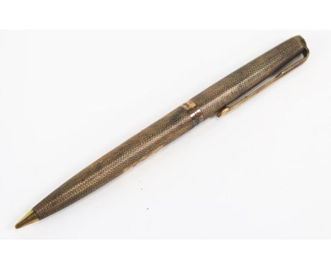 A 9ct gold Parker propelling pencil with engine turned decoration, initialled
