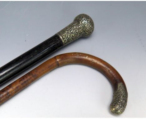 An ebonised and silver mounted walking stick, together with a malacca and silver mounted walking stick. (2).